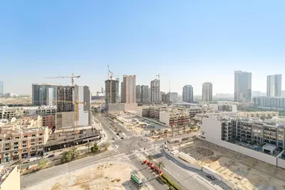 an aerial view of a city with tall buildings at VayK - Modern & Elegant 1BD in JVC in Dubai