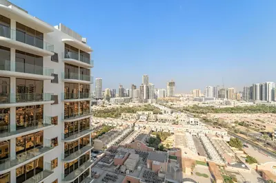 an aerial view of a city with tall buildings at VayK - Modern & Elegant 1BD in JVC in Dubai