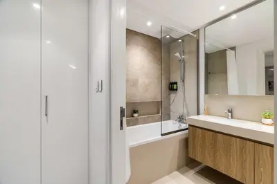 a bathroom with a sink and a shower at 4-BR Luxury Retreat with Iconic Burj Khalifa View in Dubai