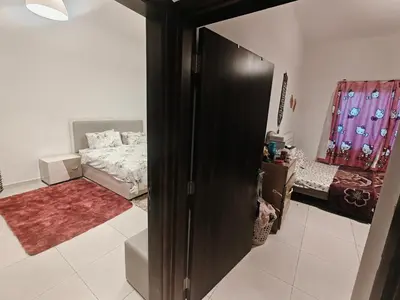 a room with a bed and a room with a closet at Furnished 2 Bedroom Apartment with Balconies in Dubai