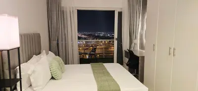 a bedroom with a bed and a window with a view at Studio in JLT near Metro - Close to Marina, JBR in Dubai