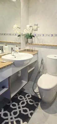 a bathroom with a white toilet and a sink at Studio in JLT near Metro - Close to Marina, JBR in Dubai