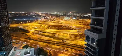 a busy city street at night with at Studio in JLT near Metro - Close to Marina, JBR in Dubai