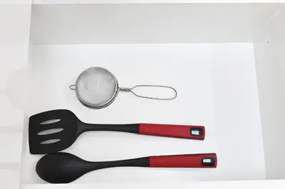 a spoon and a magnifying glass on a table at Chic 1BR Dubai Marina, 5 Min Walk JBR Beach, Metro in Dubai