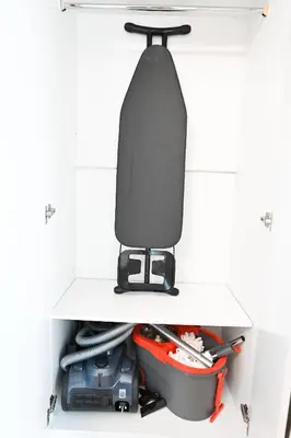 a tie sitting on top of a drawer with tools at Chic 1BR Dubai Marina, 5 Min Walk JBR Beach, Metro in Dubai