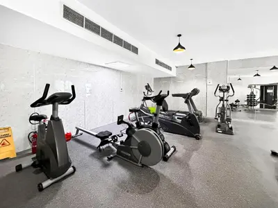 a gym with several exercise bikes in a room at Chic 1BR Dubai Marina, 5 Min Walk JBR Beach, Metro in Dubai