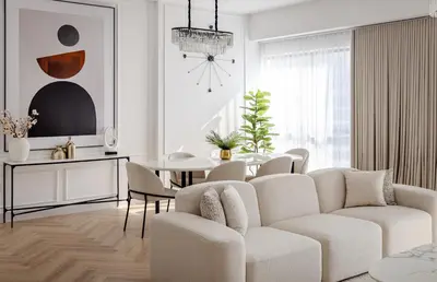 a white living room with a table and chairs at Beautiful 1 bed in JBR! in Dubai
