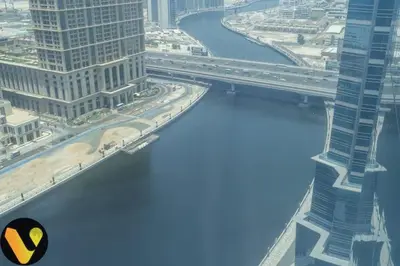 an aerial view of a river in a city at Vogue Business Bay Court Tower close to Downtown Burj Khalifa and Dubai Mall, Studio Apartment with Canal view in Dubai