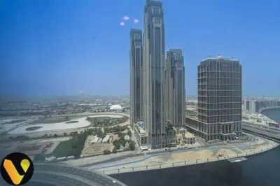 an aerial view of a city with tall buildings at Vogue Business Bay Court Tower close to Downtown Burj Khalifa and Dubai Mall, Studio Apartment with Canal view in Dubai