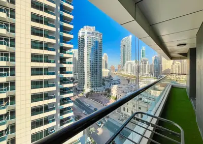 a view of the city from the balcony of a building at Brand New Two Bedrooms Apartment With Amazing Marina View in Dubai