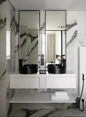 a bathroom with two sinks and a mirror at Luxurious 3br apartment Dubai mall in Dubai