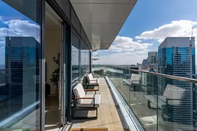 a balcony with chairs and a view of the city at Imperial Avenue, Downtown Dubai - The Mint Stay in Dubai