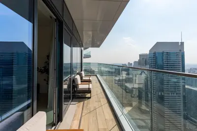 a balcony of a building with a view of the city at Imperial Avenue, Downtown Dubai - The Mint Stay in Dubai