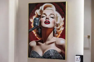 a picture of a woman holding a microphone at Binghatti Phantom luxury living 5 stars amanities in Dubai