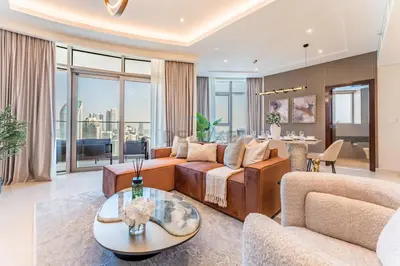 a living room with a couch and a table at Walking Distance to Dubai Mall and Burj Khalifa, Easy Access to Dubai Marina, JBR Beach and Palm Jumeirah - Imperial Avenue, Downtown Dubai in Dubai