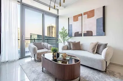 a living room with a couch and a table at Frank Porter - Silverene Towers in Dubai