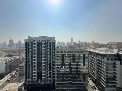 an aerial view of a city with tall buildings at Modern Studio at Binghatti Azure In Heart of JVC in Dubai