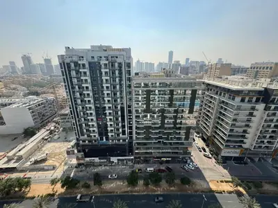 an aerial view of a city with tall buildings at Modern Studio at Binghatti Azure In Heart of JVC in Dubai