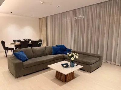a living room with a couch and a table at Luxury Bluewaters Residence in Dubai