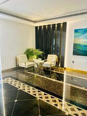 a lobby with two chairs and a table at Beautiful 1-BR next to Barasti Beach in Dubai