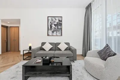 a living room with a couch and a coffee table at Skyline 1 Residence 2204 in Dubai