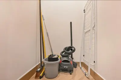 a room with two mop and a wall at Skyline 1 Residence 2204 in Dubai