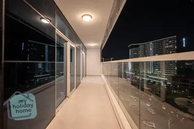 an empty hallway in a building at night at Luxury-Modern Apt with Theatre-Games-Pool-Gym in Dubai