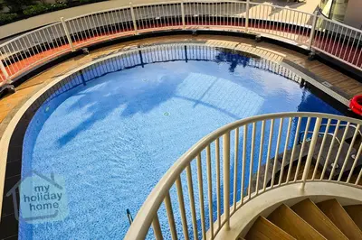 an overhead view of a large swimming pool at Luxury-Modern Apt with Theatre-Games-Pool-Gym in Dubai