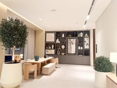a living room with a table and chairs at 21 Vida Dubai Mall 1 bedroom in Dubai
