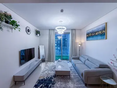 a living room with a couch and a tv at 21 Vida Dubai Mall 1 bedroom in Dubai