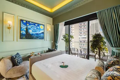 a hotel room with a bed and a large window at BLVD Cozy Stay with Balcony View 10mn to Downtown in Dubai