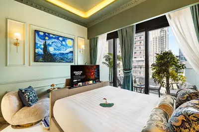 a bedroom with a large bed and a large window at BLVD Cozy Stay with Balcony View 10mn to Downtown in Dubai