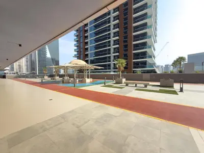 a view of a courtyard with a large building at Elegant 2BR - Top Amenities - Elite Business Bay in Dubai