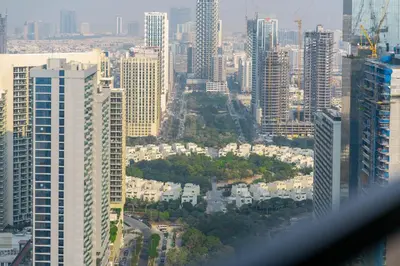 an aerial view of a city with tall buildings at The Royale Beige Jacuzzi Suite 36 2-4 I JVC I Dar Oasis in Dubai