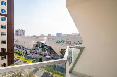 a view of a building from a window in a building at Studio with Seamless Mall Access, Steps from the Bus Stop, Binghatti Stars, Dubai Silicon Oasis by Deluxe Holiday Homes in Dubai