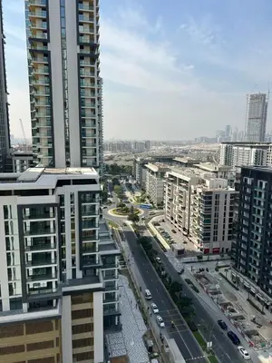 an aerial view of a city with tall buildings at Deluxe 1BR with maid's room, 10 min to Downtown in Dubai