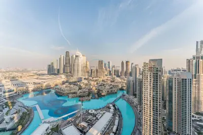 an aerial view of a city with tall buildings at High-Floor Luxury 2BR with Full Burj Khalifa & Fountain Views, Seamless Access to Dubai Mall and Burj Park, Grande, Downtown Dubai by Deluxe Holiday Homes in Dubai