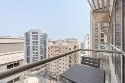 a balcony with a view of a city at StayShort - Roomy 2BR in Al Barsha with Balcony - Sleeps 4 in Dubai