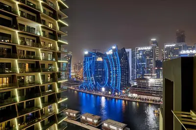 a city at night with a river and buildings at Premium 15 Northside Residences in Business Bay, Close to Downtown Dubai & Burj Khalifa by Stayfinity in Dubai