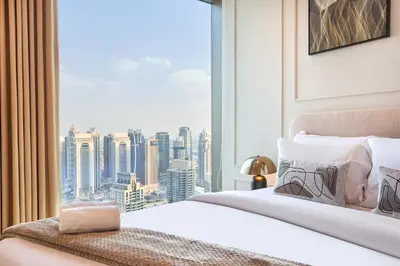a bedroom with a large window with a city view at Luxury High Floor 4 Bedrooms with Marina Views by Stayfinity in Dubai