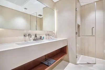 a bathroom with a sink and a shower at Luxury High Floor 4 Bedrooms with Marina Views by Stayfinity in Dubai
