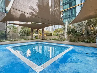 a swimming pool with a dog in the middle of a building at Luxury High Floor 4 Bedrooms with Marina Views by Stayfinity in Dubai