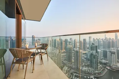 a dining room with a view of a city at Luxury High Floor 4 Bedrooms with Marina Views by Stayfinity in Dubai