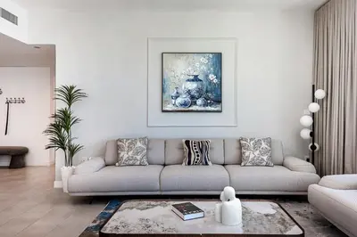 a living room with a couch and a table at La Vie Apartments in Dubai