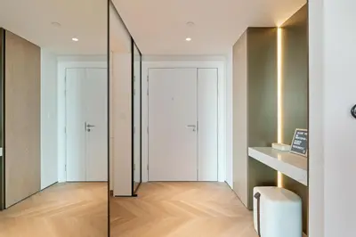 a hallway with sliding glass doors in a apartment at Luxurious 2BR Breathtaking Huge Pool & Sea Views in Dubai