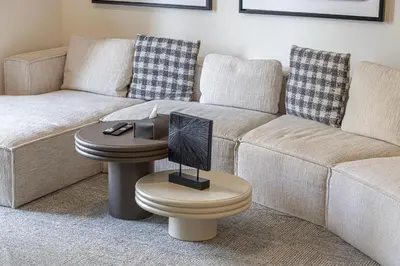 a living room with a couch and a table at Luxury 2BR Downtown Dubai, Grande Signature with Stunning Burj Khalifa and Dubai Opera Views, steps to Dubai Mall by La Brisa in Dubai