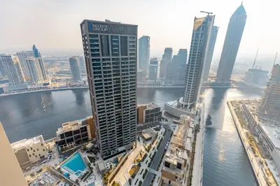 a view of a city with a river and buildings at PENINSULA ONE 1BR by Design Studio in Dubai