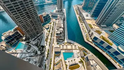 an aerial view of a city with tall buildings at PENINSULA ONE 1BR by Design Studio in Dubai