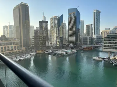 a view of a river with boats in a city at 810 Elegant Marina View Apartment Near Tram, Dining & Nightlife, Bay Cental in Dubai