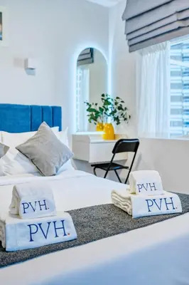 a bedroom with two beds with towels on them at PVH - Dubai Gate 1 - Cozy Central Studio in JLT in Dubai